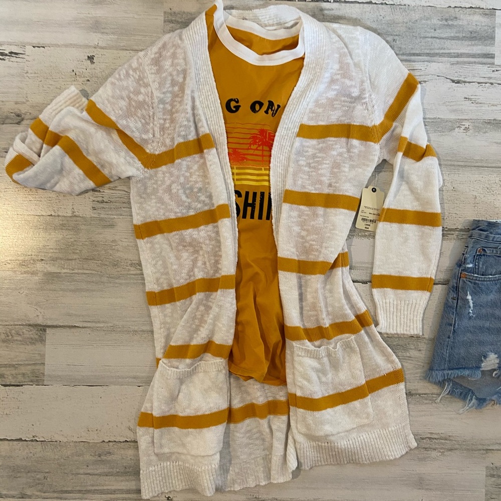 White cardi with gold stripes
